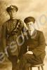 Two men, one in army uniform, one in navy uniform.