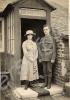 Soldier standing by porch with young woman. c. 191