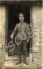 Sergeant wearing Boer War medal ribbon standing in