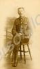 Sergeant with wound stripe sitting on a chair c.19