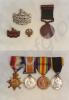Two photographs of the medals and regimental badge