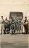 Group of soldiers mostly in fancy dress in front o